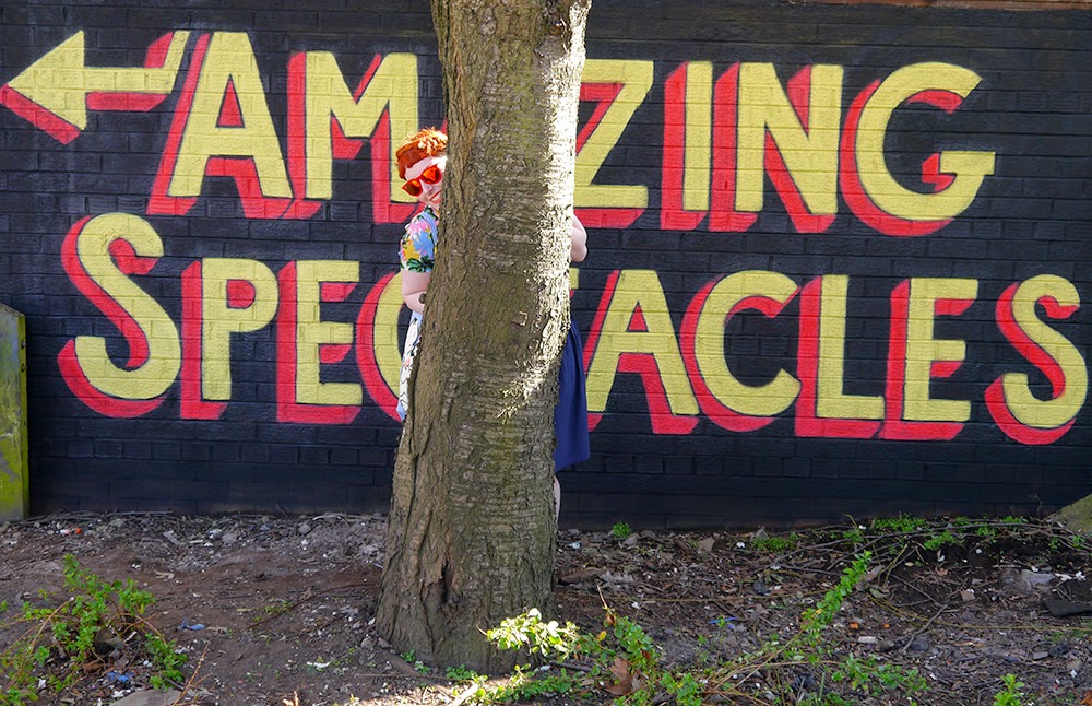 Amazing Spectacles at Spex Pistols Scottish Blogger, Red Head, Ginger, Styled by Helen, Dundee, Amazing Spectacles, Graffiti, Tropical shirt, Luna on the Moon, Hair Slides, pom pom, Sun Glasses Shop, velvet sunglasses, rayban, Ray-Ban, Cheap Frills heart earrings, bright outfit, summer outfit, summer style, Abandon Ship, Kewpie tote bag, Rock Cakes brooch, Bonnie Bling name ring, Spex Pistols
