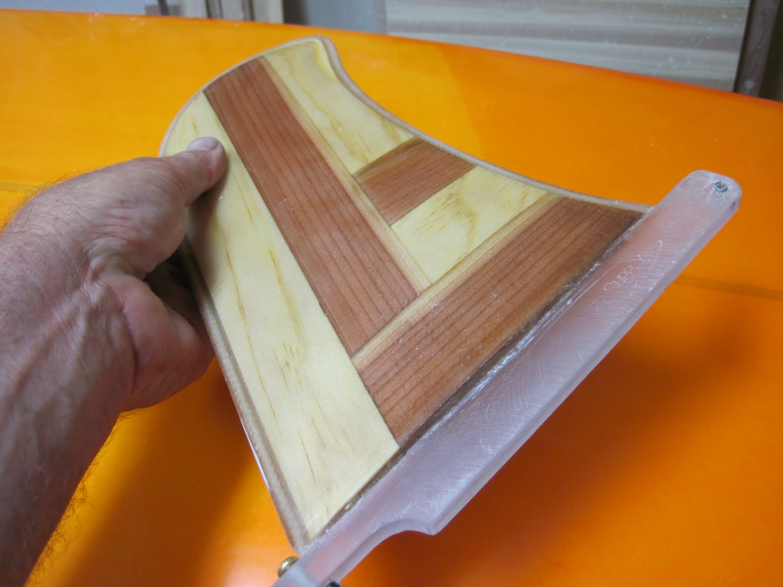 the artist known as Huck homemade pivot fin for longboard