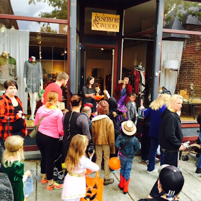 Reservoir & Wood handing out candy to kids during Beacon's Hocus Pocus Parade.