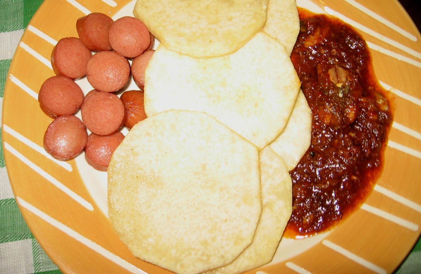Nigerian Fish tomato Stew with fried yam, sausages