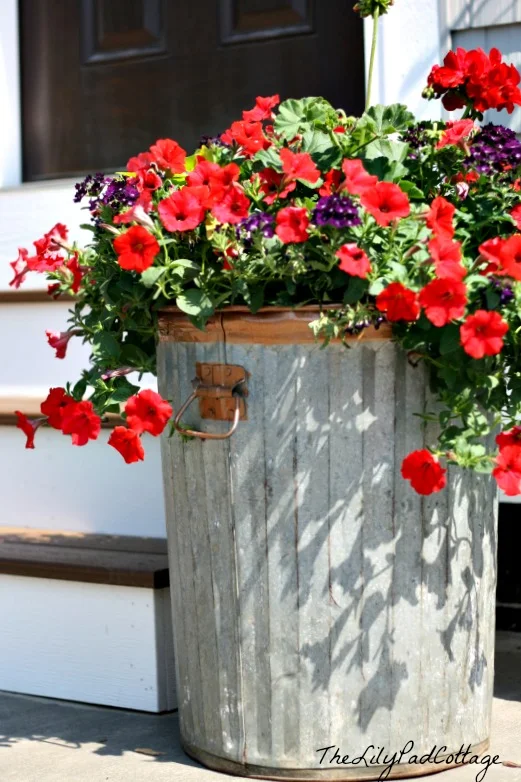 Rustic garbage can planter by The LilyPad Cottage featured on I Love That Junk