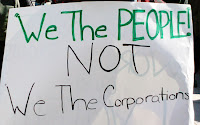 sign saying, we the people, not we the corporations