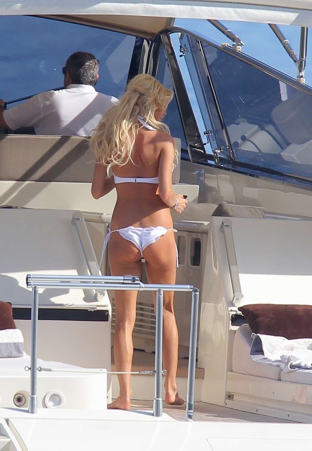Victoria Silvstedt  on a yacht in Monaco wearing a skimpy white bikini