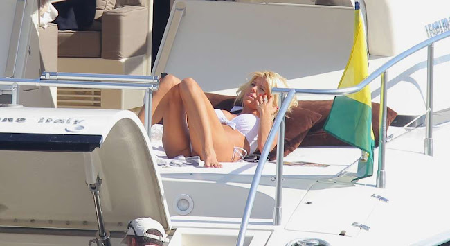 Victoria Silvstedt looking at the blue sky from a yacht in Monaco
