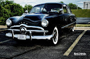 This late 40's Ford reminded me of a police car. It had the black paint, . (car )