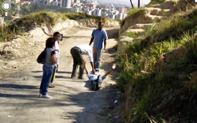 guy is beating a man on street view guy is beating a man on street view
