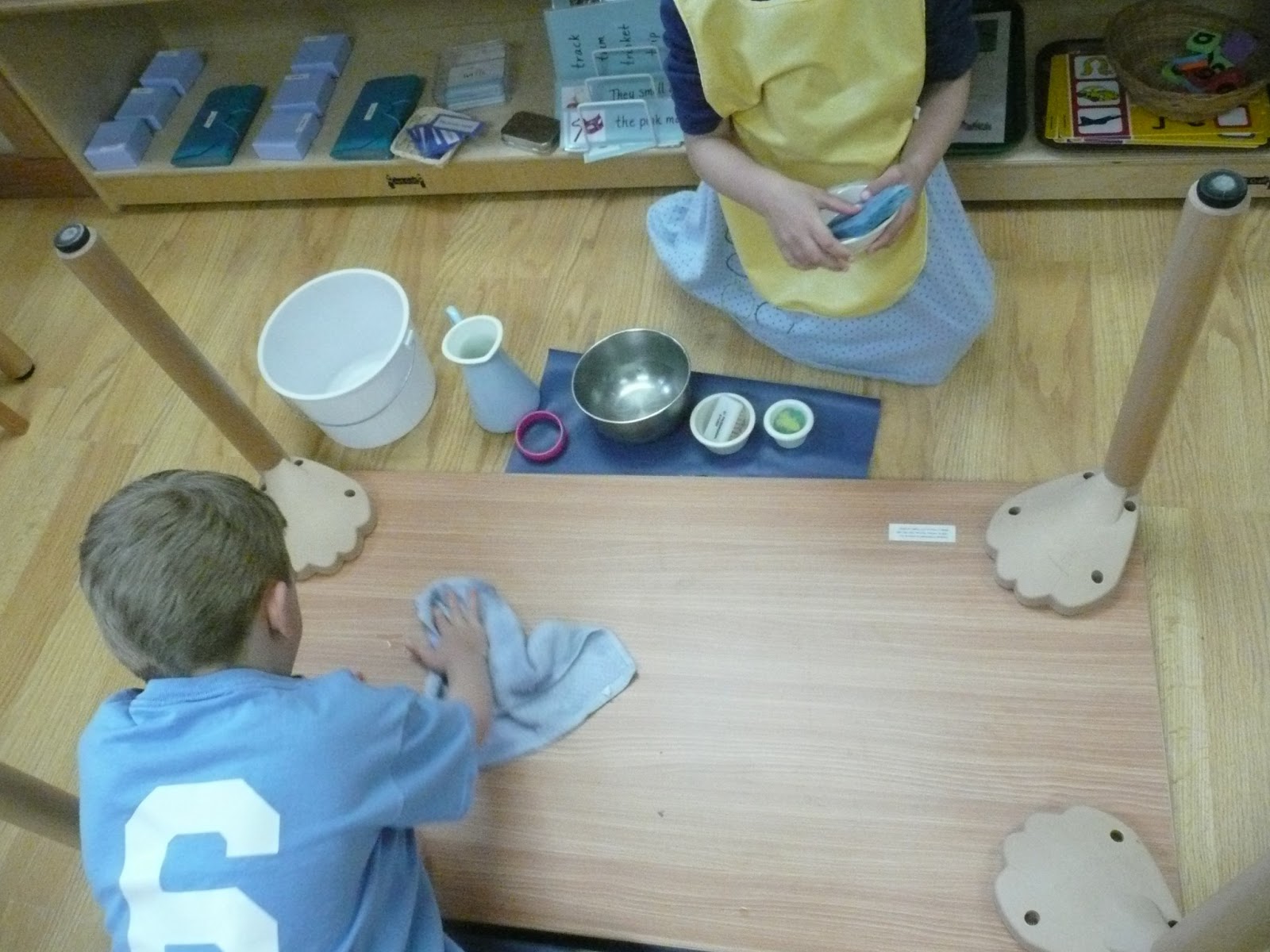 Montessori Teachings: Table Washing (even the bottom)!