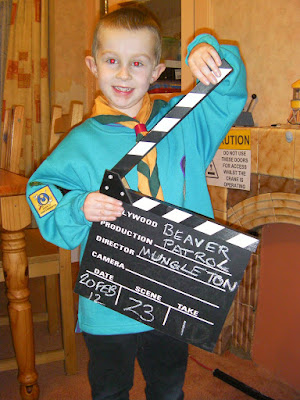 beaver scout uniform and film clapperboard