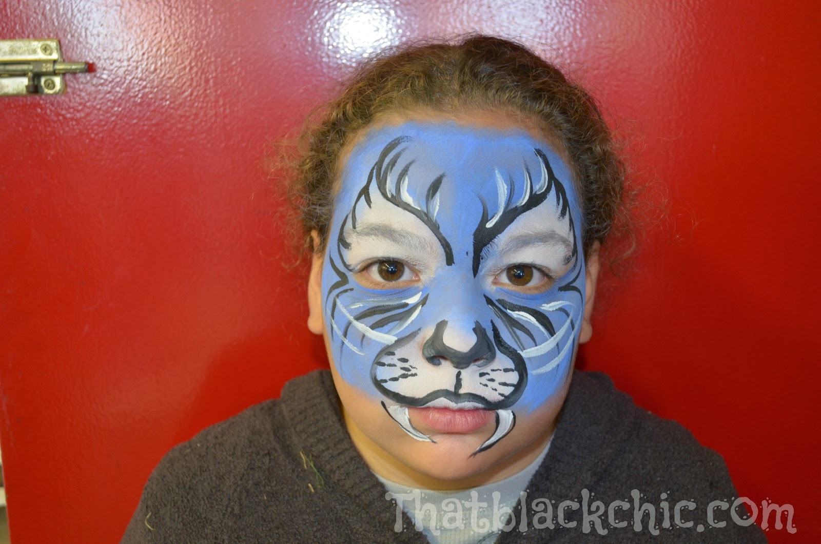 Giving back by volunteering Face Painting the kiddies That Black Chic