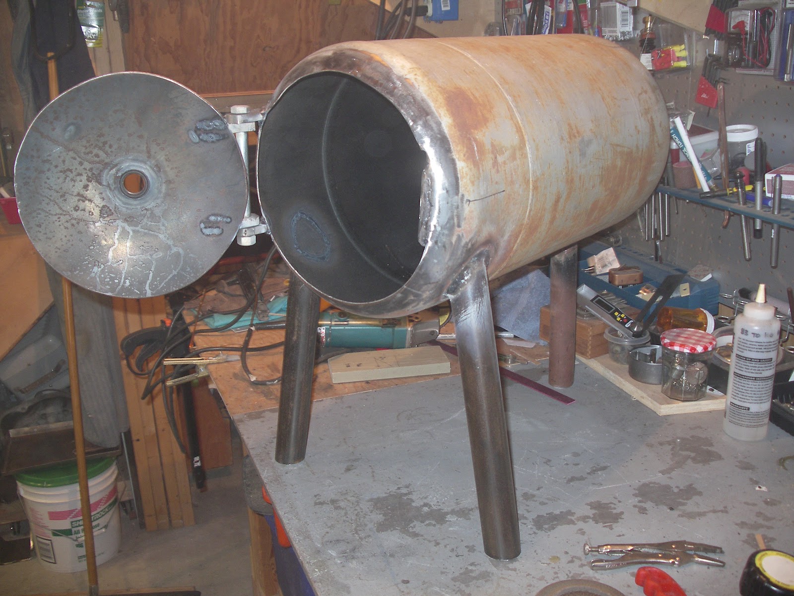 Nails and Sawdust Cobbling together a new wood stove out of a propane