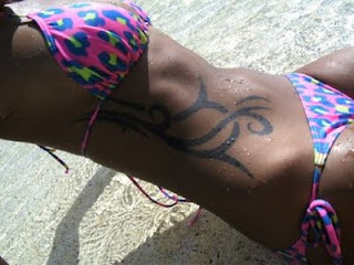 Black Ink Tribal Tattoo on Girls Side Body