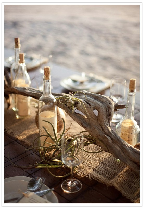 Centerpieces Using drift wood glass bottles and even sand are amazing 