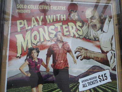 Large poster for a monster movie-type show with man and woman running in terror from a ghoul