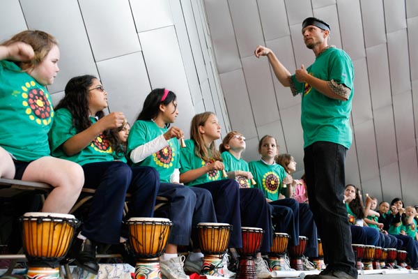 Avo teaching percussion.