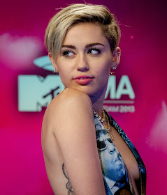 Miley Cyrus Backless and Braless Cleavage At MTV Europe Music Awards 2013 in Amsterdam Miley Cyrus Backless and Braless Cleavage At MTV Europe Music Awards 2013 in Amsterdam