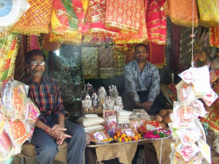 Shop owner in his market stand, Delhi
