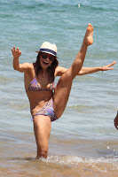 Sarah Shahi strange pose in a bikini