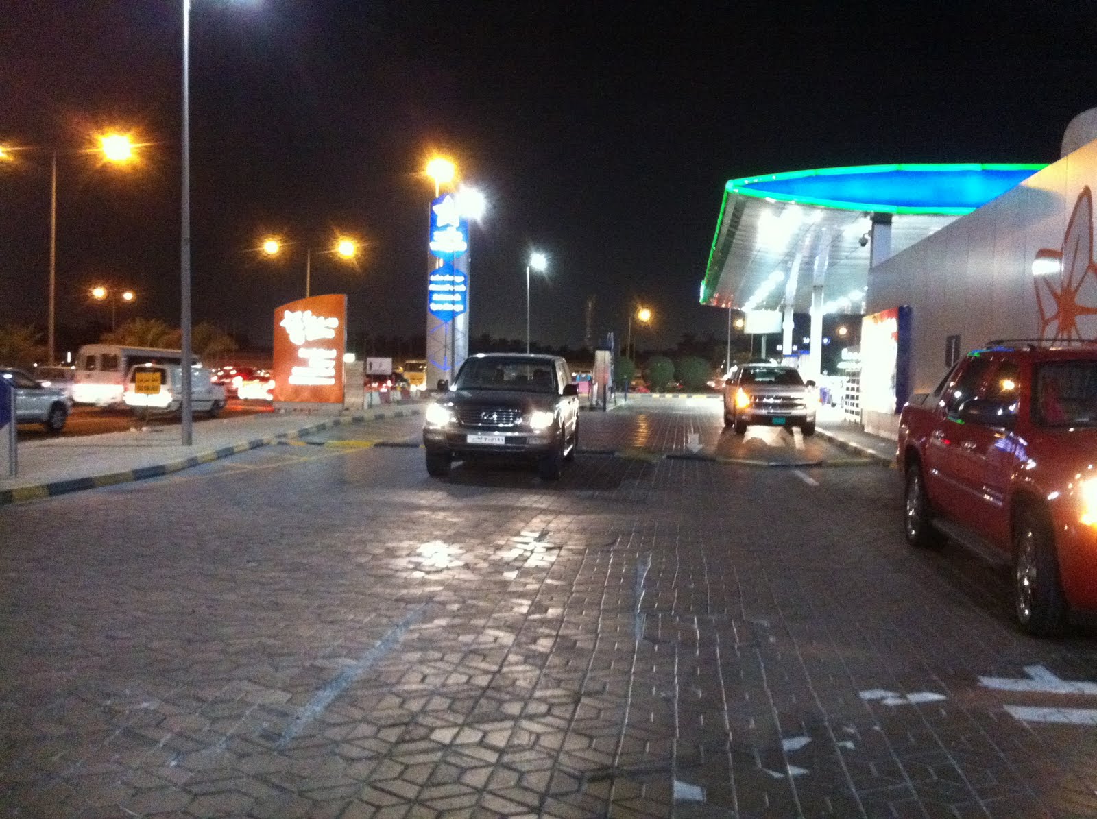 Qatar Culture Club WOQOD Petrol Station in Doha Examining Social