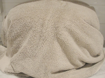 crock pot wrapped in towel