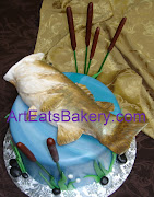 3D large mouth bass fish on fondant pond Groom's cake with cattails, . (custom designed edible large mouth bass topper on fondant pond groom cake with cattails rocks and grass picture)