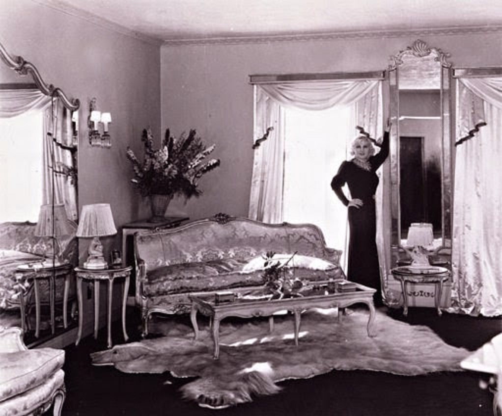 Mae West in her living room.