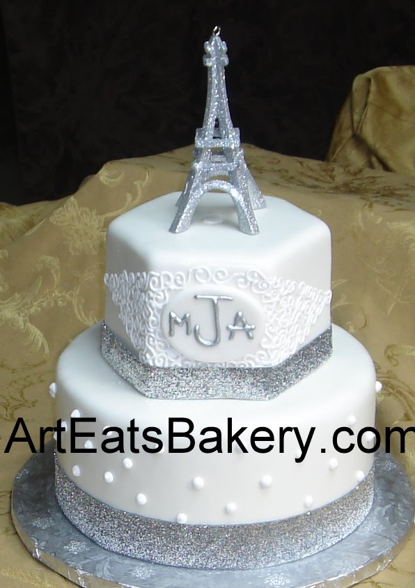 Two tier custom white fondant birthday cake with monogram curlicues silver