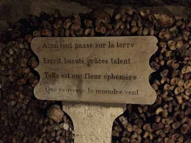 The Catacombs of Paris is simply a must-see during your visit.  Here the remains of over 6 millions people are stacked to form long stretches of tunnels.  A few hundred years ago the city was dealing with multiple cave-ins at cemeteries throughout the city and simply not enough room to bury the dead.  There's a really good article here about the churches struggle for trying to keep the cemeteries going.   I found my favorite coffee shop in Paris walking to the Catacombs and stumbled upon many cute streets, stores, shops, and cafes along the way.  This was a wonderful day of exploring and a really unique memory to have.    Tourist Advice:  Arrive as early as possible to the entrance (Place Denfert-Rochereau, 75014 Paris).  There is a metro stop right across the street, but we walked from the 2nd Arr.  There will likely be a queue already, walk to the doorway and get a time ticket.  This is not your ticket to enter, but the time slot in which you are to come back and visit.  The reasoning is because there is a limit as to how many visitors can come per hour (200), because of the historical significance of the site and in order to maintain it's integrity.  For instance, we arrived around 10AM and mistakenly stood in the line for 40 minutes until we noticed other people with color-coded time tickets.  So we walked to the doorway, got a time ticket and had to wait until 5:30PM to take the tour.  This was only a minor inconvenience because we spent the afternoon visiting the Luxembourg Gardens and getting lunch in Saint-Germain des Près.       More from my trip to Paris soon... 