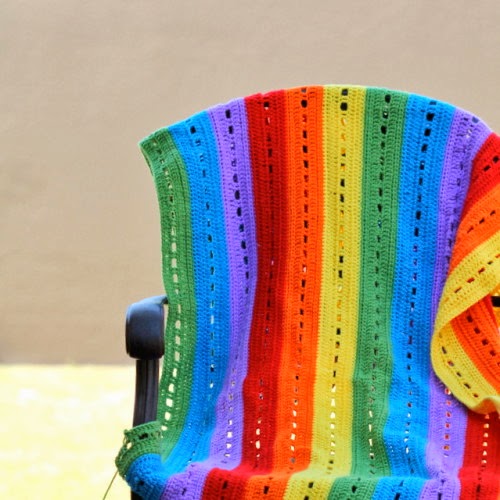 http://thecraftymummy.com/2014/01/rainbow-stripe-crochet-blanket/