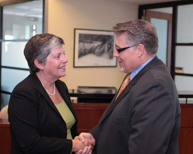 Secretary Janet Napolitano shakes hands