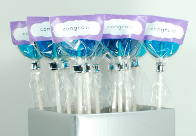 purple congratulations labeled hard candy lollipops