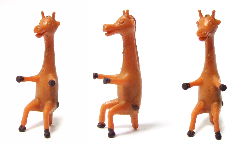 down to the cellar Small plastic Giraffe seeks wheels!
