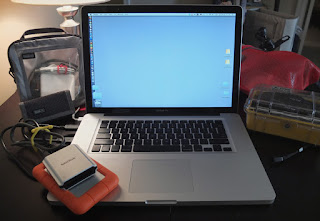 Apple 15" powerbook with LaCie Rugged 1TB drive and SanDisk FW 800 CF card reader.