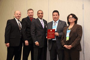 Stephen Dicker, a member of the Project EnCriPT Advisory Board, accepts IACP's Dave Cameron Award for the Houston Police Department.