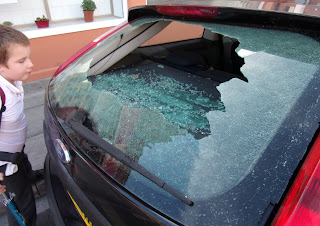 vandals broke car window ford escort