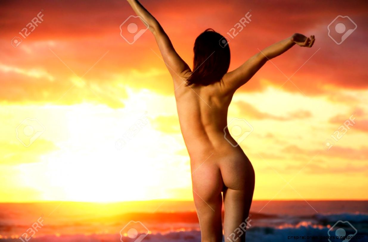 Carefree Girl On Beach With Sunrise In Background Stock Carefree Girl On Beach With Sunrise In Background Stock