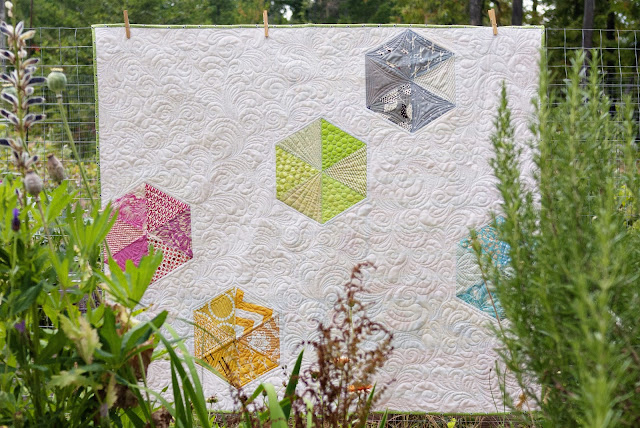 scattered hexstatic quilt hexagon baby quilt