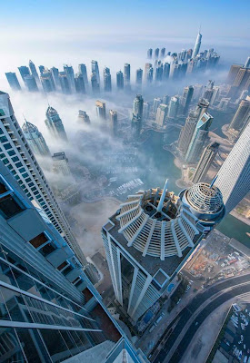 Dubai-based German photographer Sebastian Opitz captures the surreal and mystical look of his adopted city as fog rolls in and out at sunrise. The photographer renames the cityscape as Cloud City for the brief moments when the mist takes over and fills the empty space between the towering buildings. Optiz's images offer a serene and dreamy view of a bustling city, re-imagining it as a heavenly metropolis in the sky.