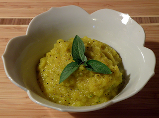 Bowl of Golden Beet Soup with Herb Garnish
