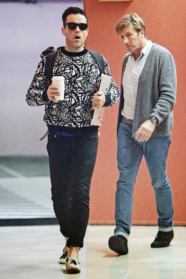 Robbie Williams wears Dior Homme by Kris Van Assche Fall Winter 2014 circular patterned black white sweater at Beverly Hills 4th November 2014