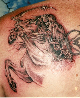 Death tattoo on the back: Death riding his horse