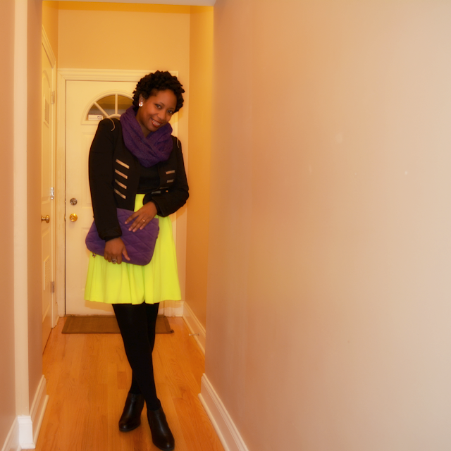 neon green skater skirt worn with black and purple accessories
