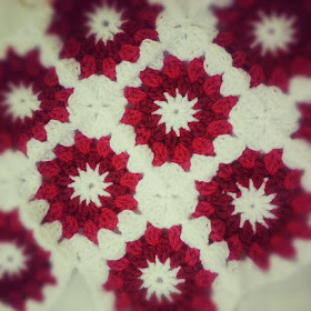 Crochet starburst cushion cover in red and white