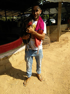Frenchman Mr Mehdi with his "Cock Bird".The only expatriate among a entire crowd of local Laotians.