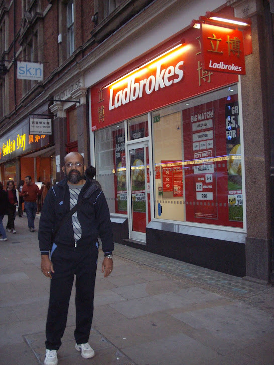 Self outside "LADBROKES" in LONDON.