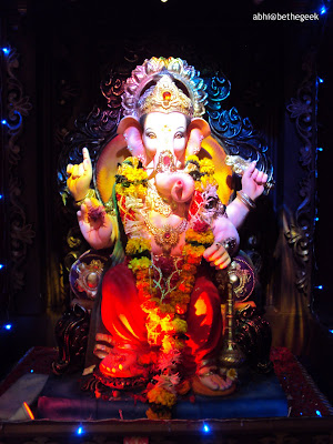 Huge Ganesh idol brightly lit up in a Mumbai suburban Ganpati pandal