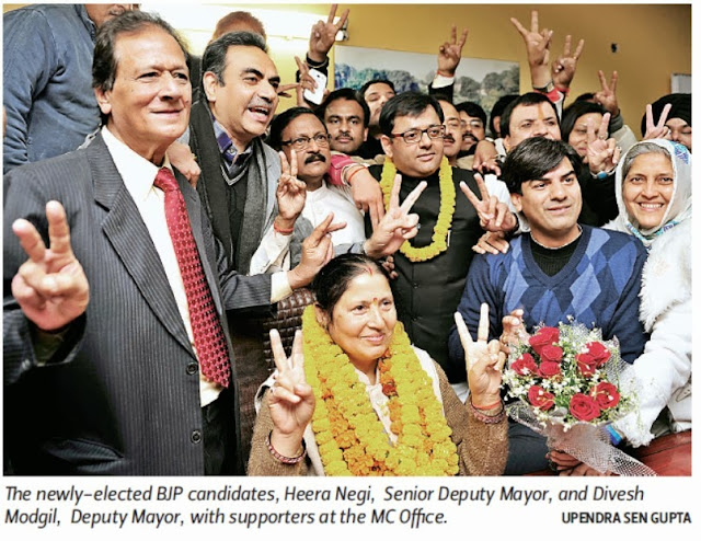 The newly - elected BJP candidates, Heera Negi, Senior Deputy Mayor, and Davesh Moudgil, Deputy Mayor, with Ex-MP Satya Pal Jain and others at the MC Office