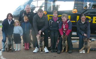 Sitting in front of the Force helicopter with their walkers