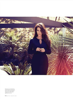 Kim Kardashian wearing a glamorous black dress in the garden