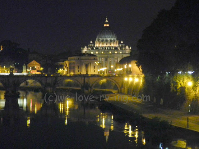 We see St. Peter's Basilica lit up in the distance