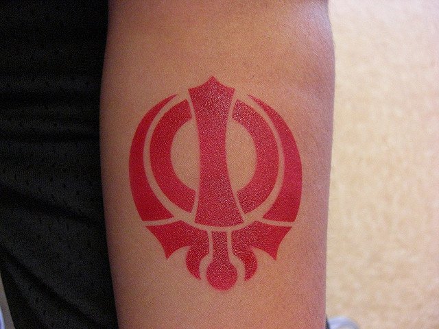 Tattoos Designs, Pictures And Ideas Red Khanda Tattoo On Arm